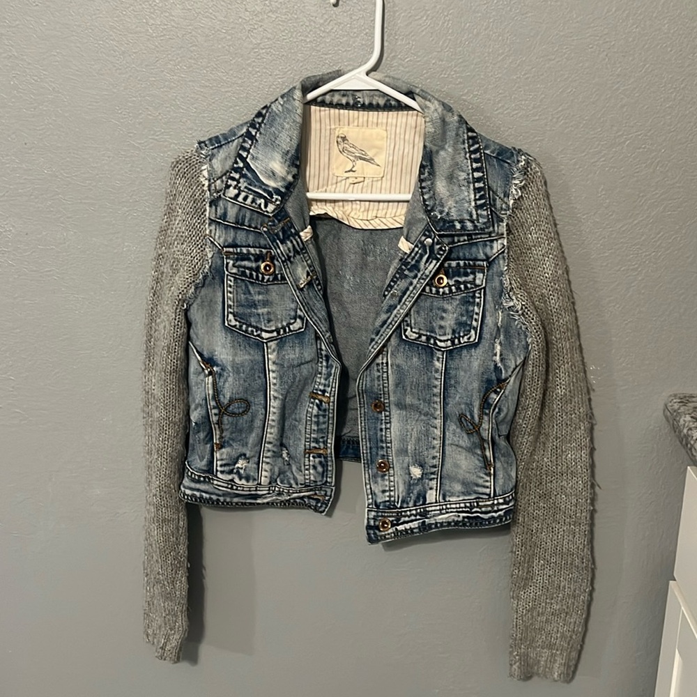 Denim jacket with knitted sleeves